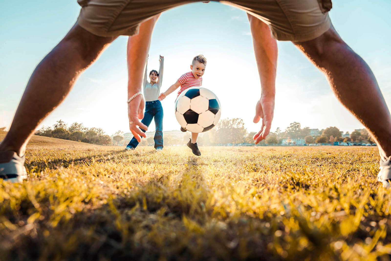 kid-kicking-football-ball-while-playing